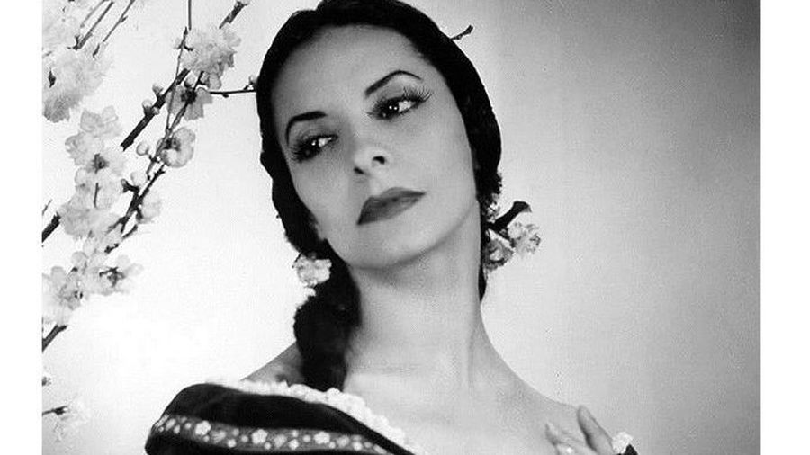 Alicia Alonso and partner in a poised pas de deux, showcasing dynamic connection and controlled line
