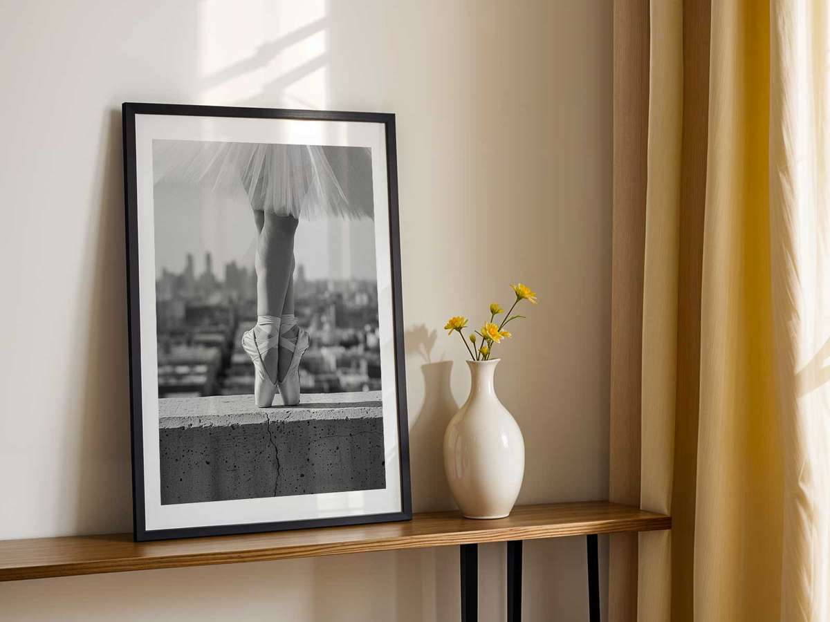 Backlit ballerina in black and white, the tutu rendered as a delicate outline against luminous background