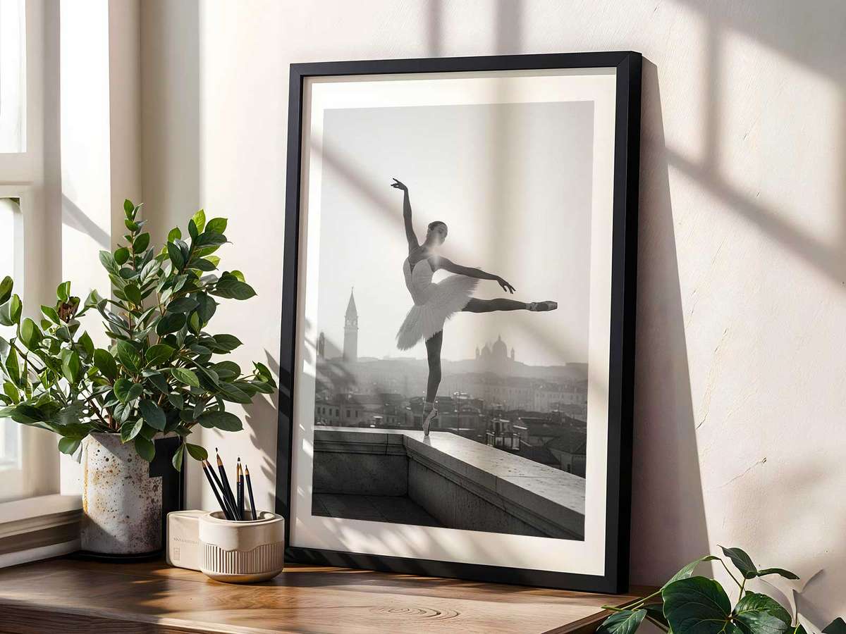 Silhouette of a ballerina on an open balcony overlooking a canal at dusk, softened by grain and paper texture