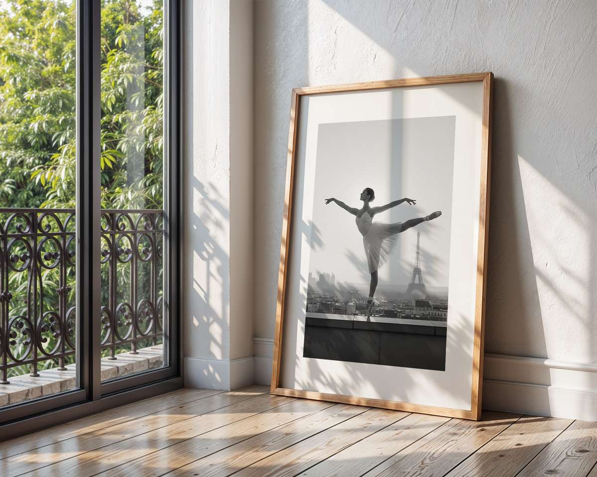 Silhouette of a ballerina on an ornate balcony against faded Parisian facades and soft film grain