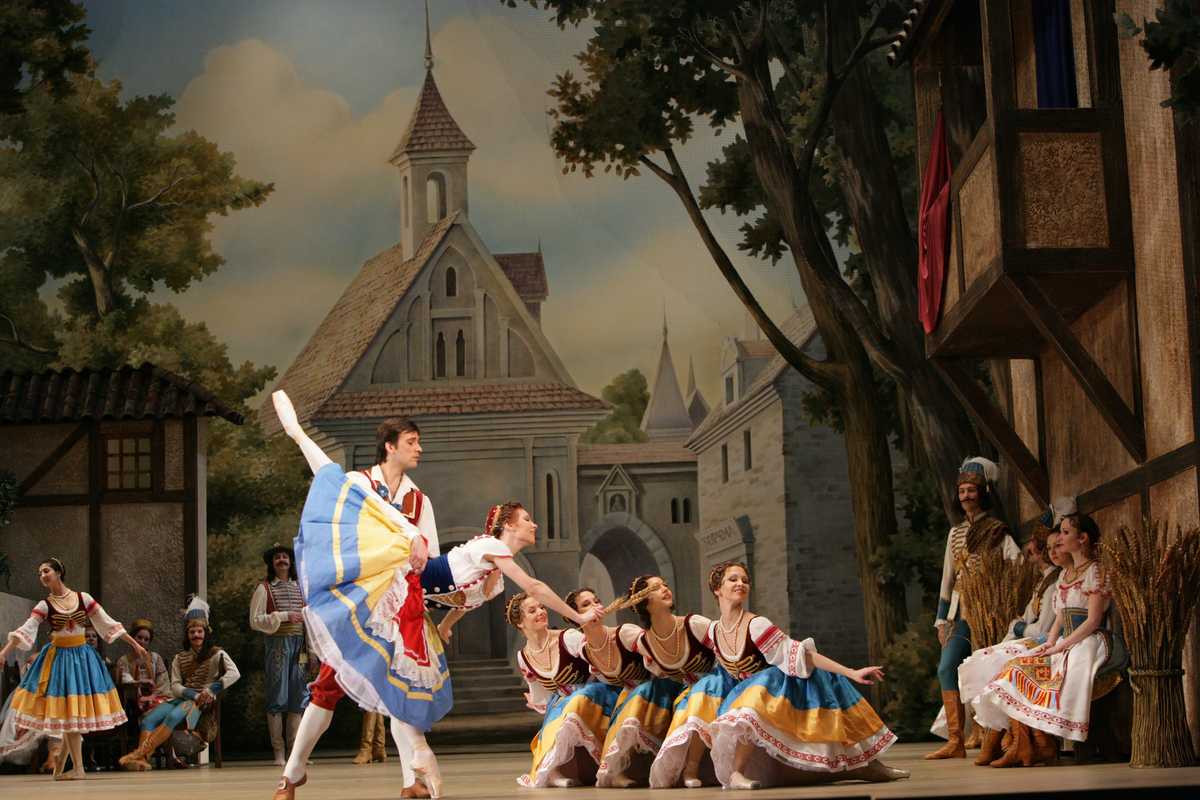 Historic poster-style image evoking the 1870 Paris premiere of Coppélia with dancers in period costumes