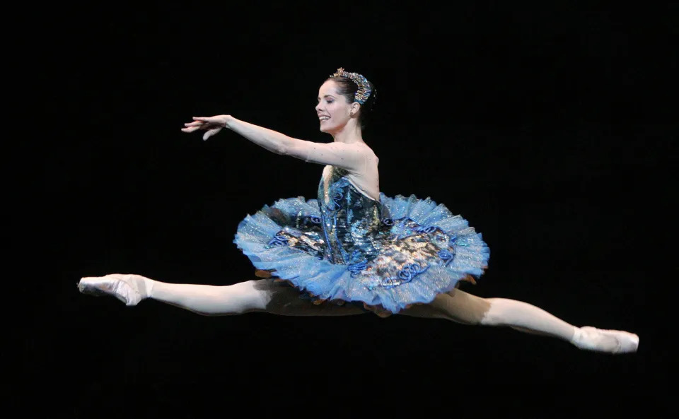Darcey Bussell rehearsing with fellow students at the Royal Ballet School, focused on technique