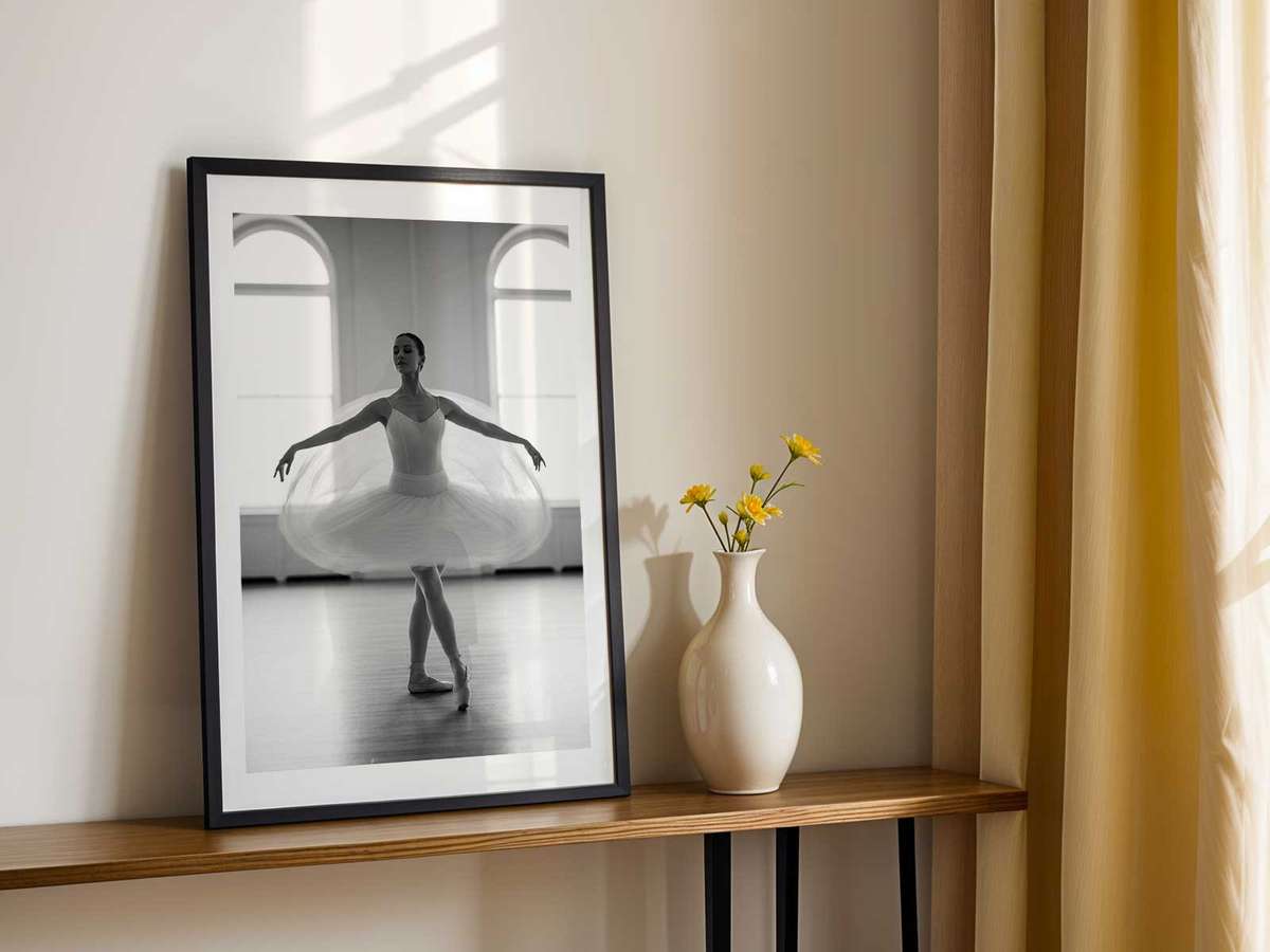 Detail of a dancer’s feet at the barre, pointed and flexed, conveying the foundational work that shapes larger expressive…