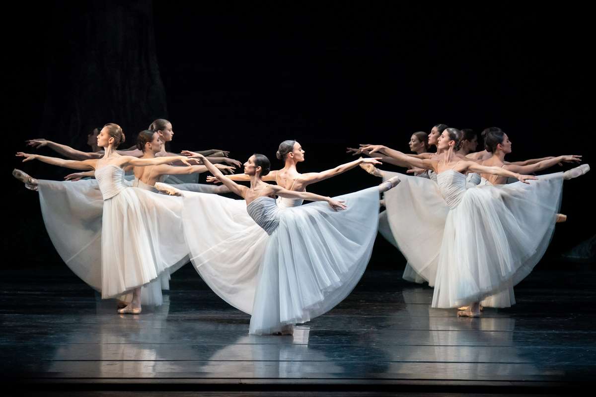 Giselle collapsing in a dramatic moment of madness as her grief and betrayal overwhelm her on stage