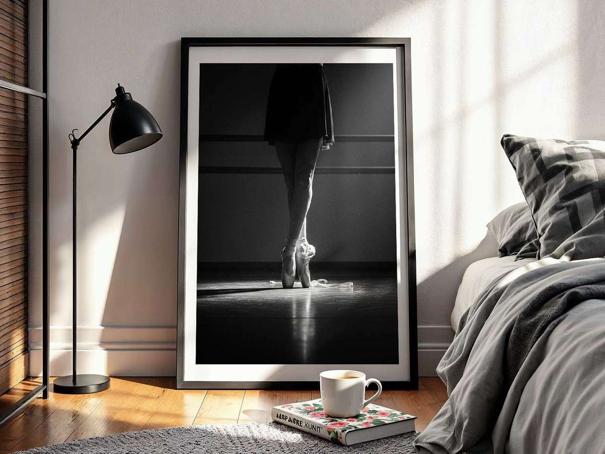 Ballerina frozen mid-grand jeté across the studio floor, limbs fully extended and intensity visible in every line