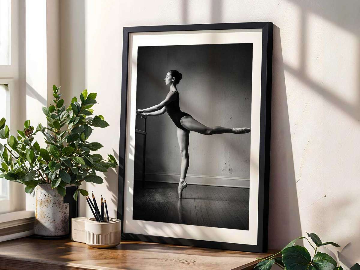 Close-up of a dancer’s hands lightly gripping the barre, suggesting concentration, support and subtle gesture
