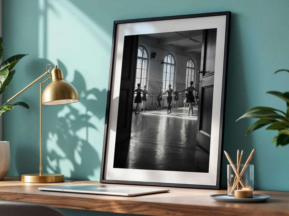 Dancer holding a subtle hands-over-heart pose, framed by empty studio space and an intimate hush
