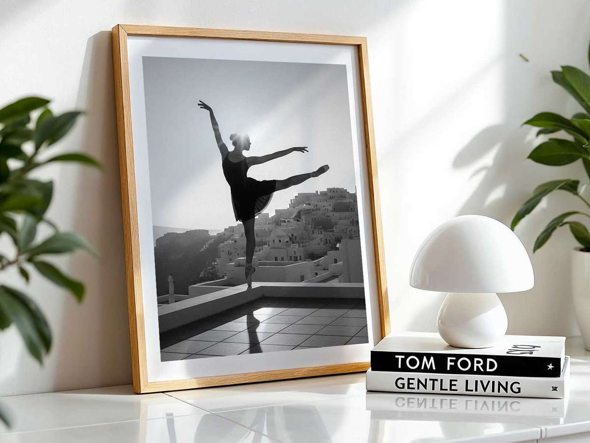 Portrait of a ballerina seated on marble stairs with soft grain texture and a classical compositional style