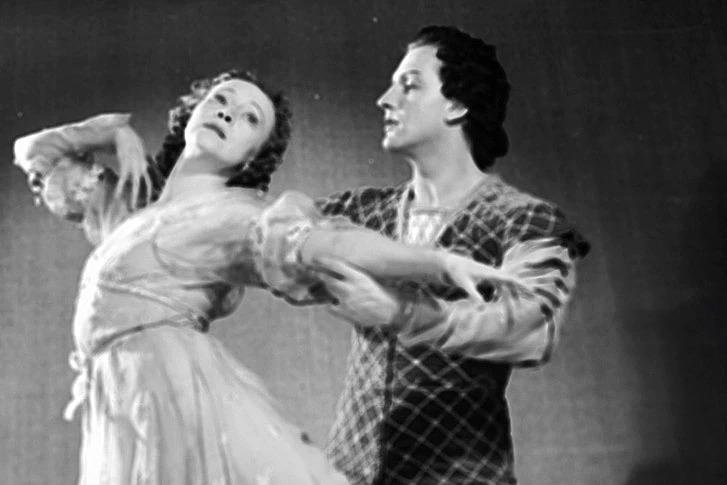 Margot Fonteyn shaping a lyrical phrase with expressive arms and gentle épaulement, embodying musical phrasing