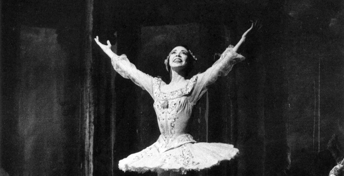 Margot Fonteyn and Rudolf Nureyev performing a pas de deux, exchanging a dramatic gaze amid an emotive lift