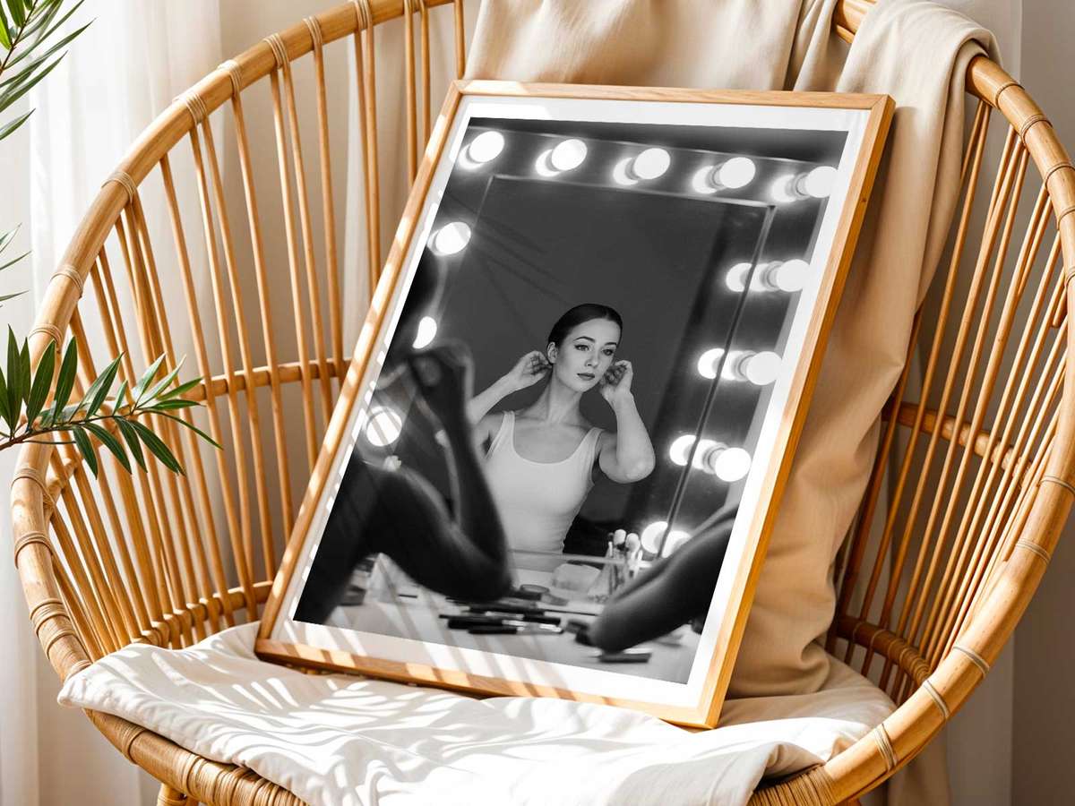Ballerina standing before a mirror moments before curtain, reflection revealing calm concentration