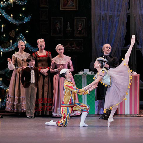 Young dancers in costume as Clara and Fritz rehearsing a scene from The Nutcracker in a studio