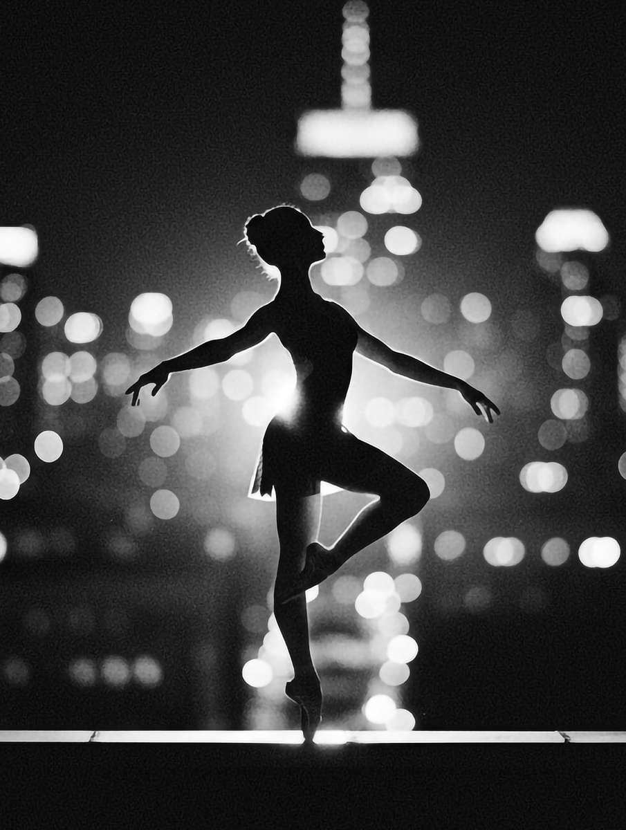 Profile portrait of a ballerina holding a poised head and elongated neck, focusing on elegant line and quiet dignity