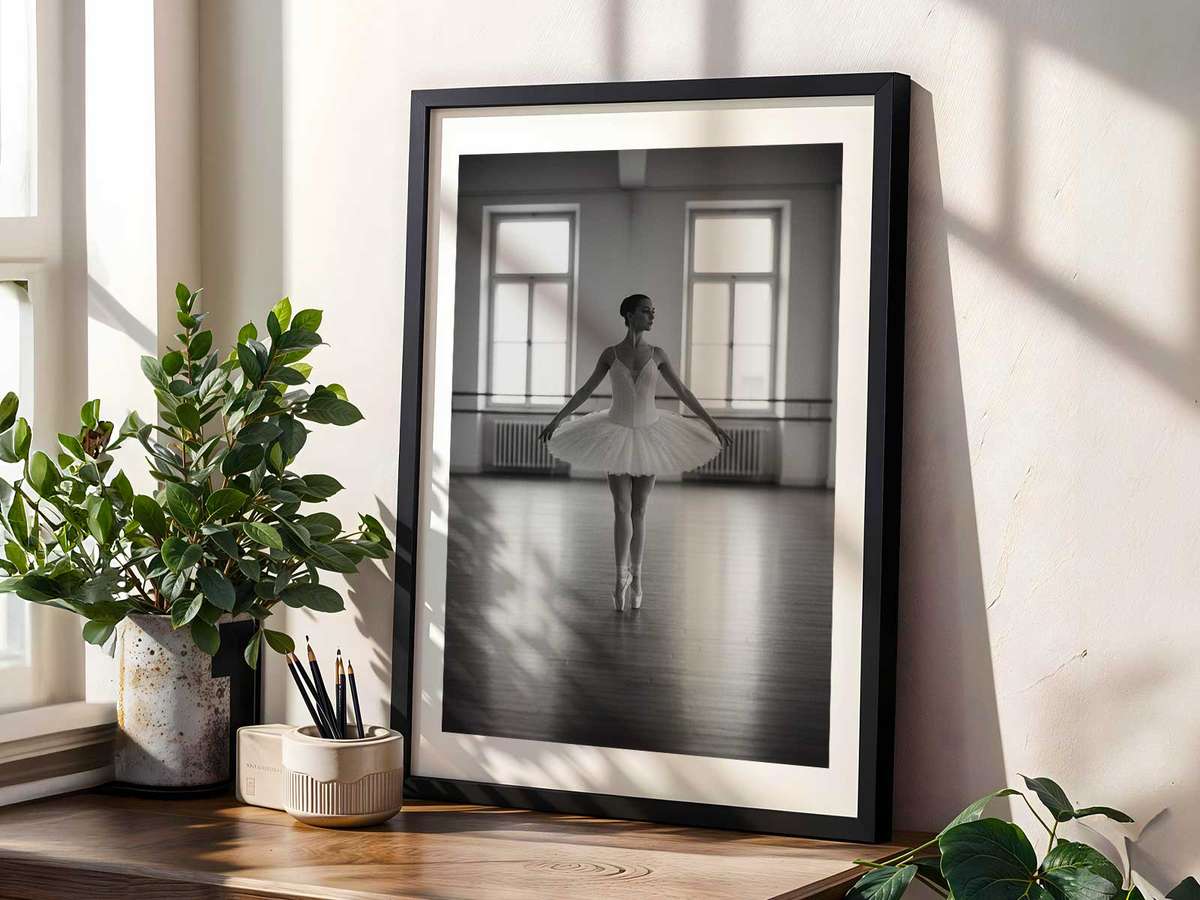 Portrait of a ballerina with focused expression and softened features, capturing the internal concentration behind her…