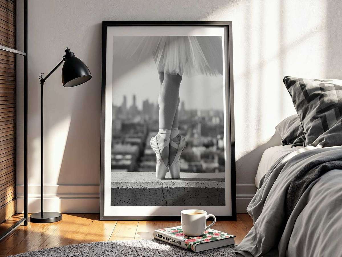 Ballerina in an arabesque pose captured center-frame to convey quiet poetry and elegant balance