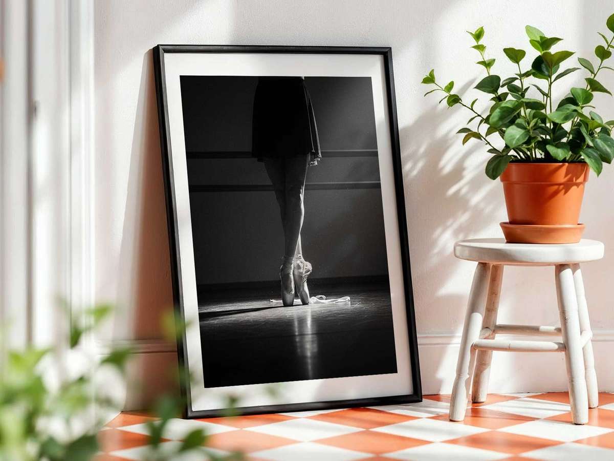 Ballerina pausing to breathe at the barre during rehearsal, expression showing fatigue and steadfast determination