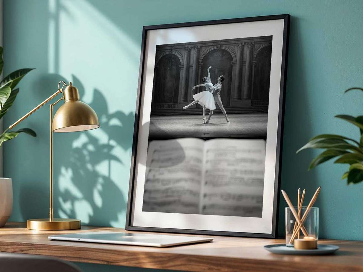 Dancer framed by rim lighting at stage edge, creating a luminous outline and emphasizing movement into darkness