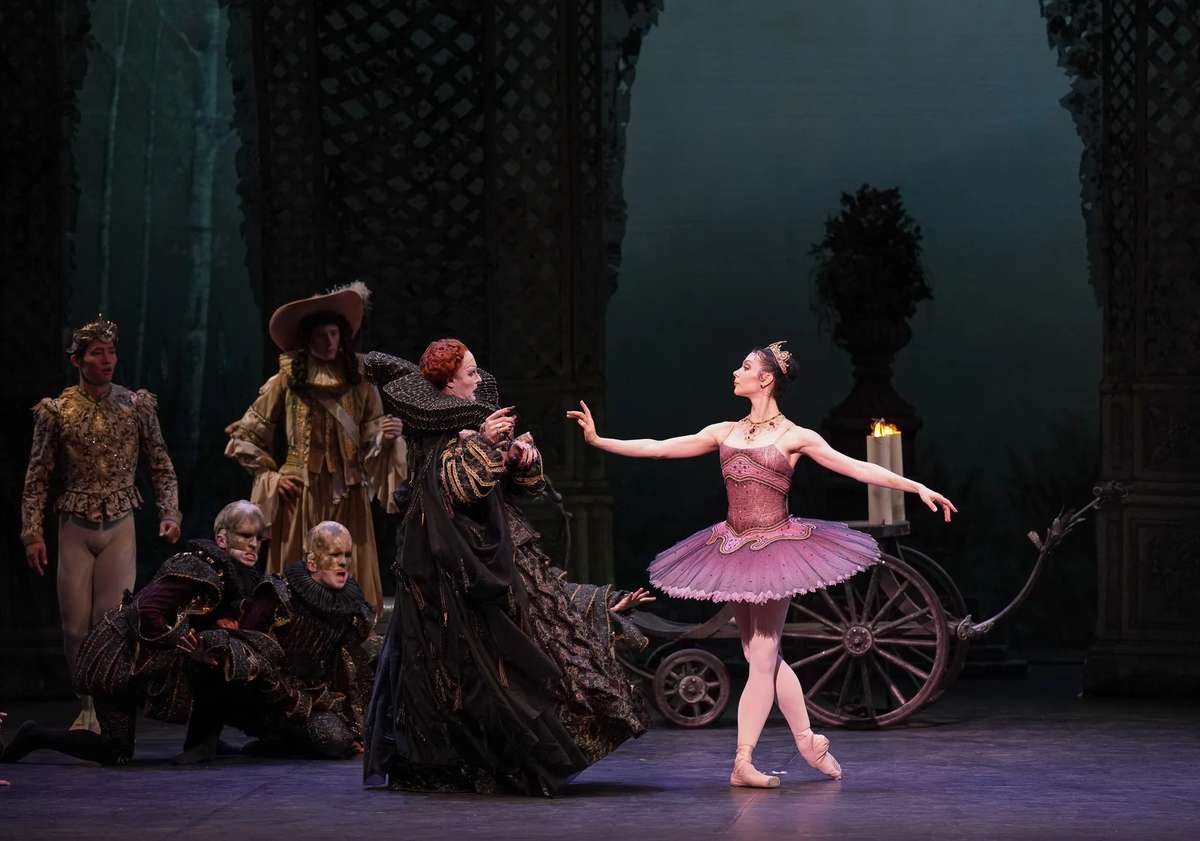 Prima ballerina performing Aurora's solo variation en pointe with raised arms and precise footwork