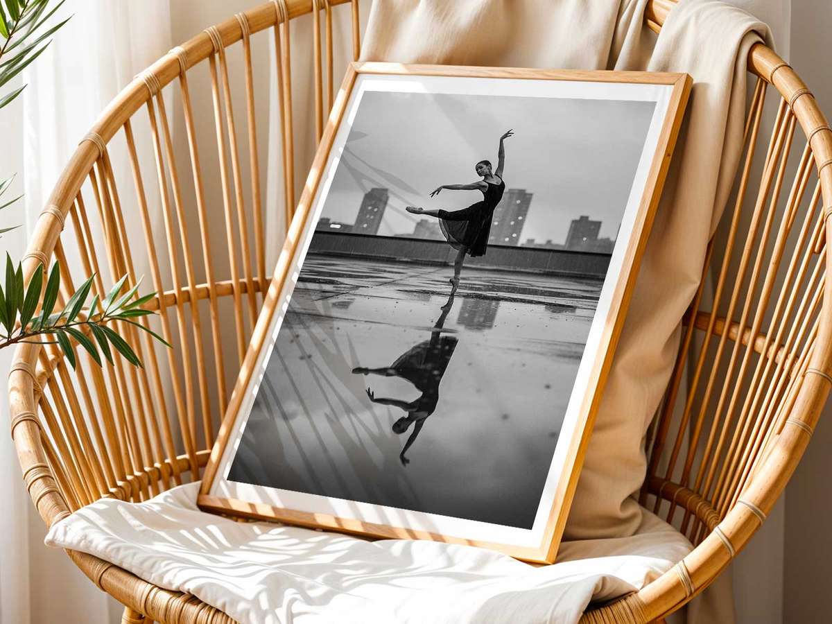 Ballerina centered in an open plaza bathed in soft morning light, creating a suspended, contemplative mood