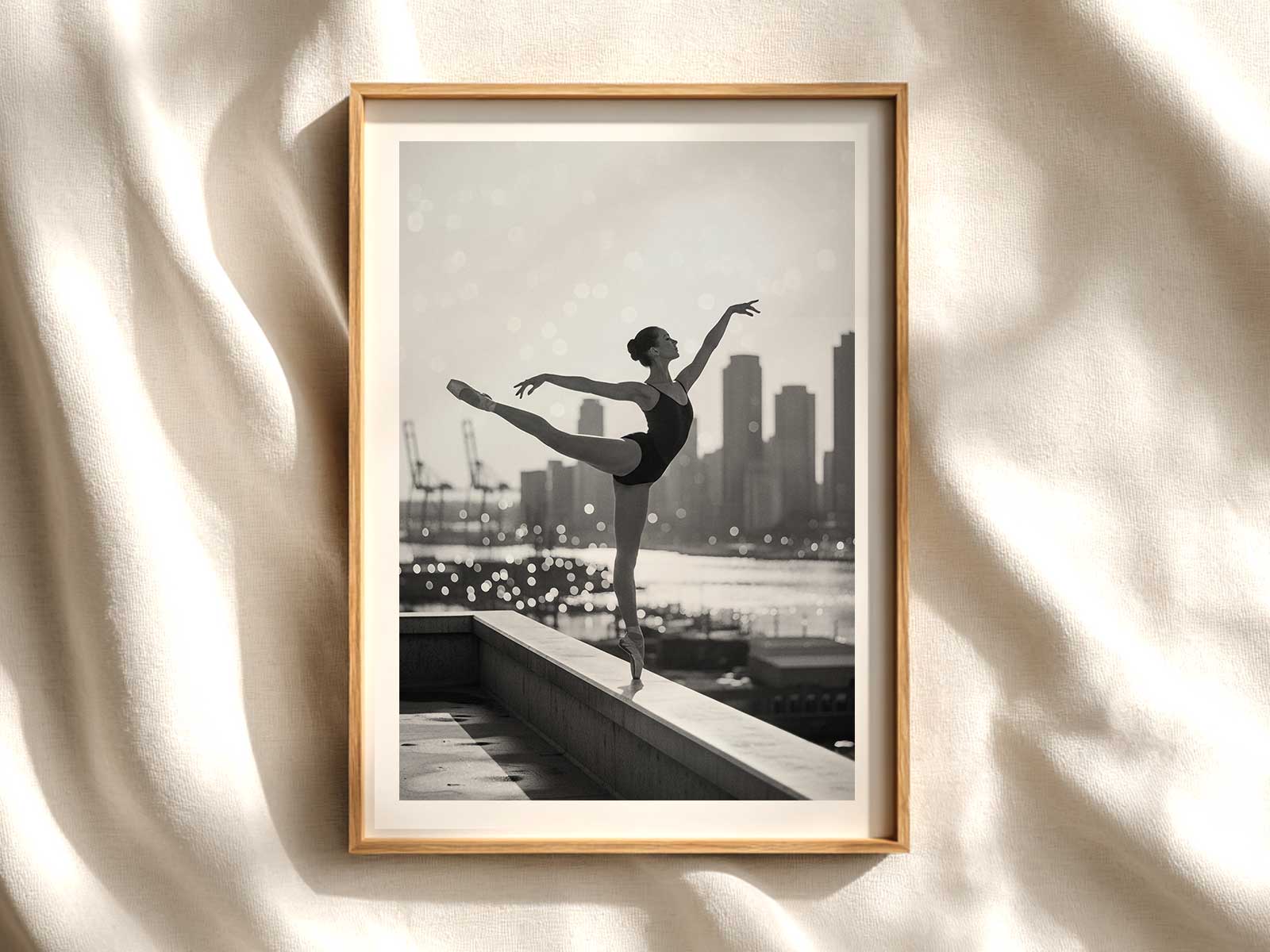 Wide view of a makeshift harbour stage where a ballerina performs under soft, golden light that evokes the calm of…
