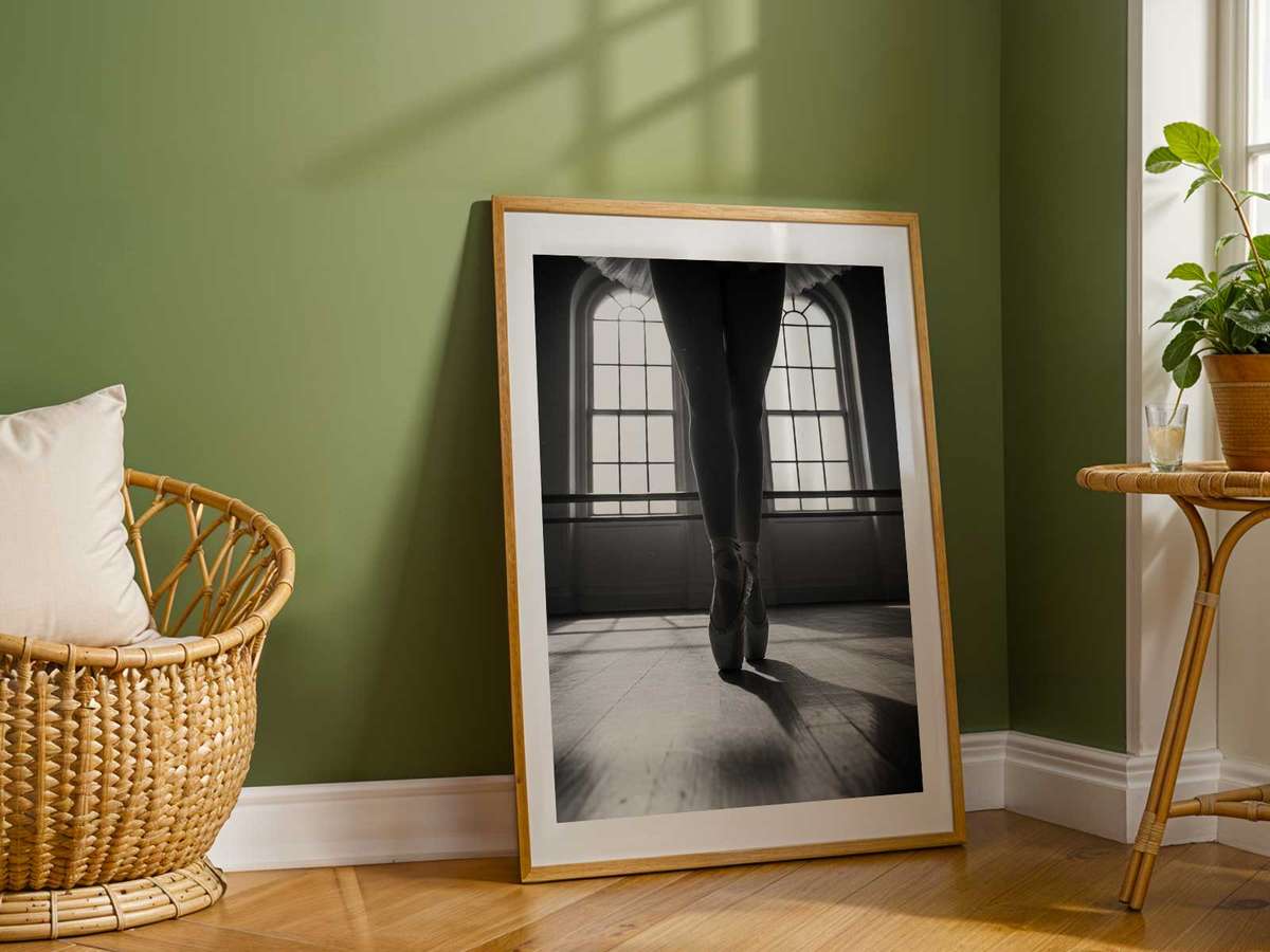 Solo dancer paused center stage with a suspended posture, capturing the held breath and concentrated stillness