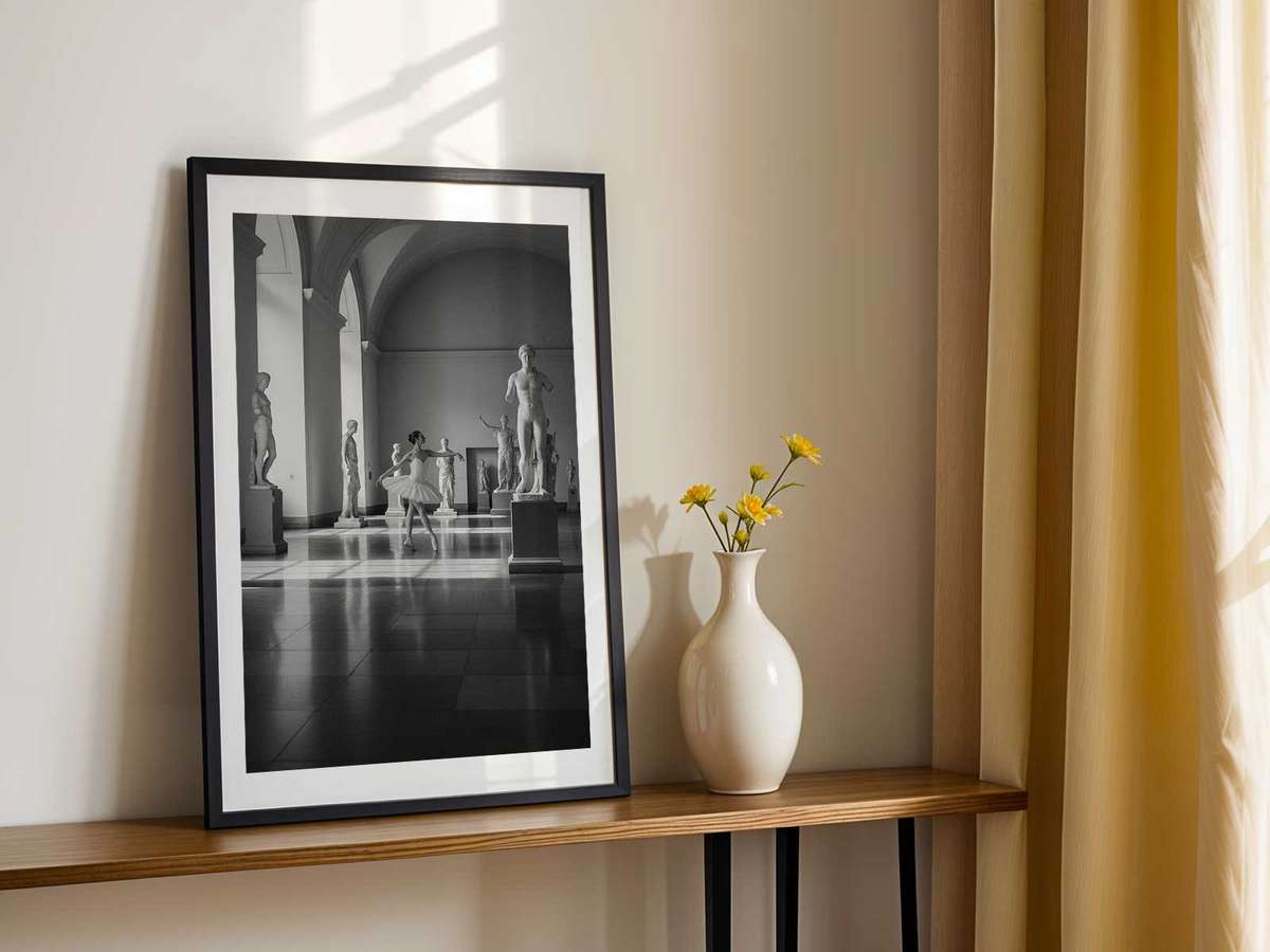 Minimal composition of a statuesque ballerina against a neutral backdrop, emphasis on form and sculptural line