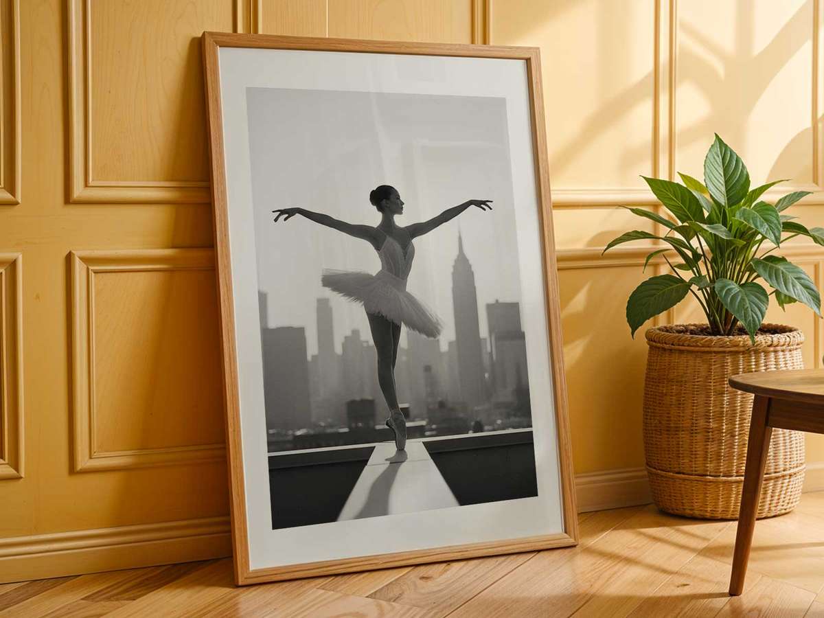 Single ballerina at rest with urban horizon lines creating a graphic contrast to her soft silhouette