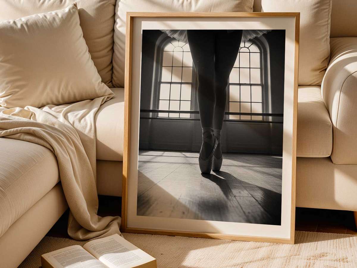 Dancer lit by edge studio lighting creating strong contrast between body and background, emphasizing form and breath