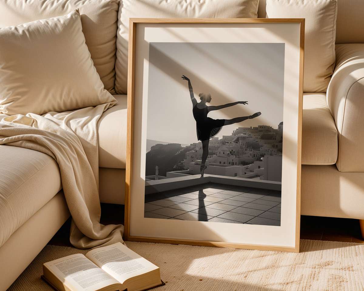 Three-quarter view of a black ballerina seated, printed with grain reminiscent of vintage negatives