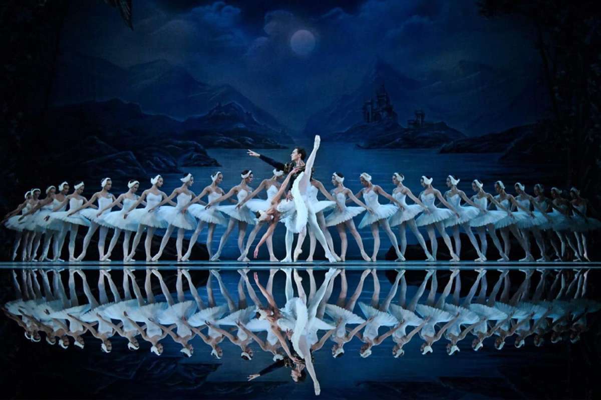 Reproduction of a printed poster advertising the 1877 premiere of Swan Lake at the Bolshoi Theatre, reflecting the ballet's…