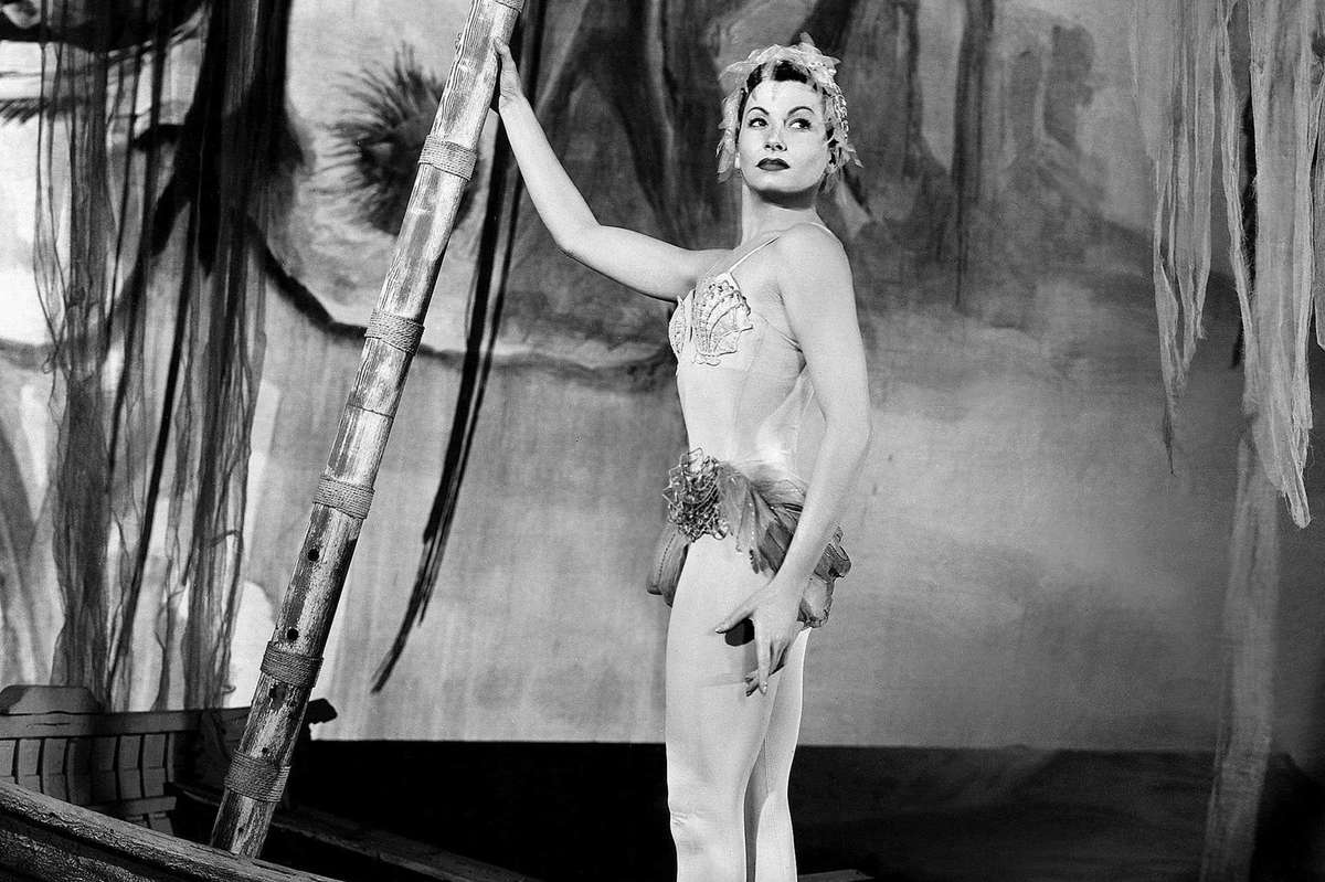 Young Zizi Jeanmaire practicing at the barre during Paris Opera school training, captured in a disciplined rehearsal moment